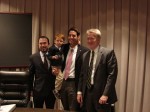 The incoming and outgoing Mayor and Mayor Pro Tem pose with Mosca's son